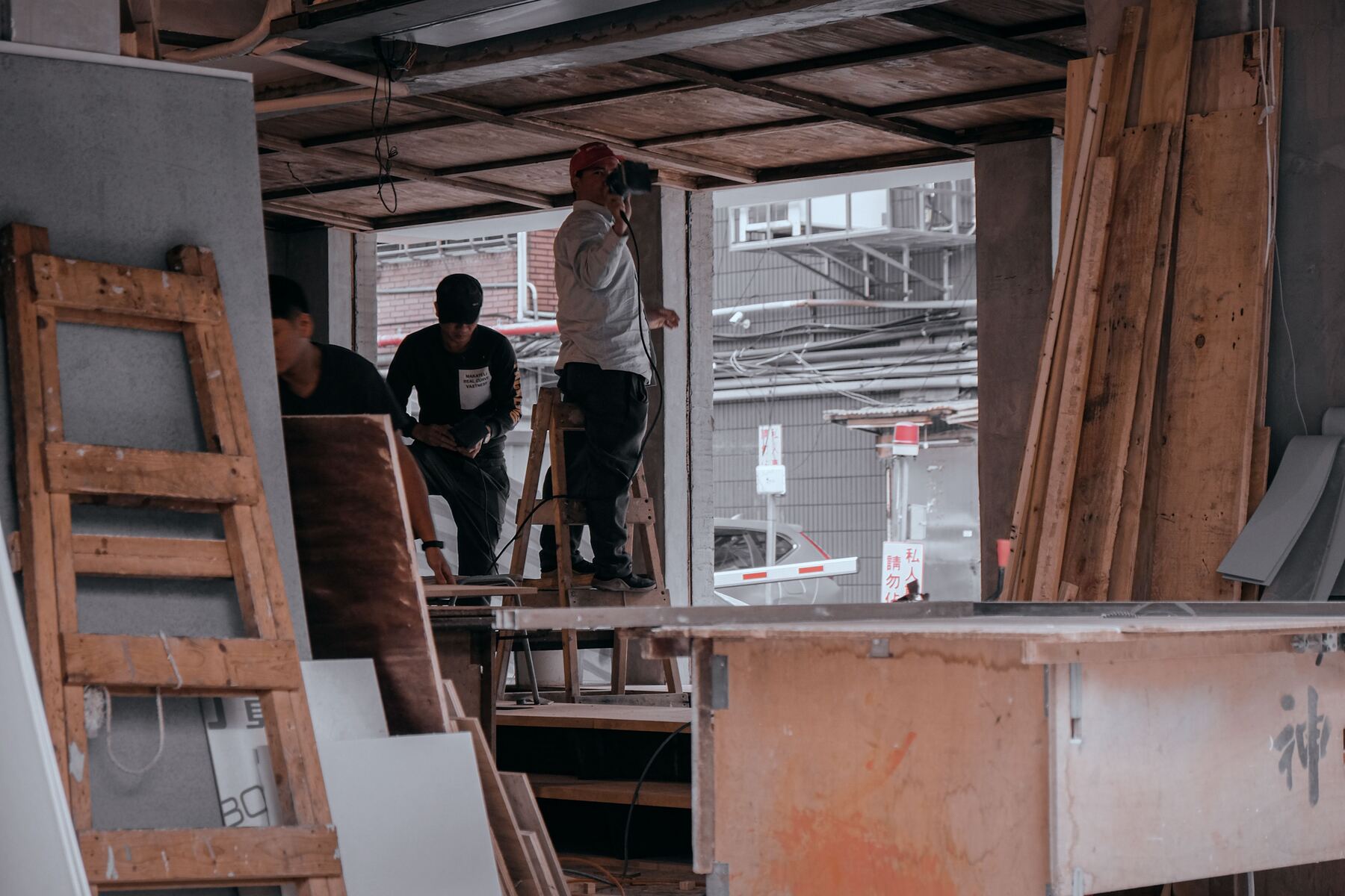 Crew renovating a gutted interior shell